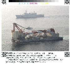 Salvaged mystery ship arrives in Kagoshima Bay for probe