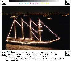 Naval ship lit up in Tokyo Bay