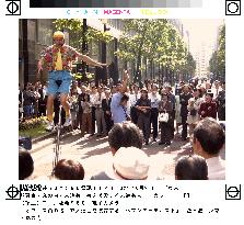 People enjoy street performance in Tokyo's Marunouchi