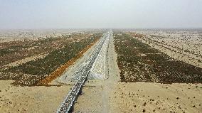 CHINA-XINJIANG-DESERT RAIL LOOP-HOTAN-RUOQIANG RAILWAY-INAUGURATION (CN)