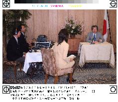 Koizumi voices reform resolve on radio