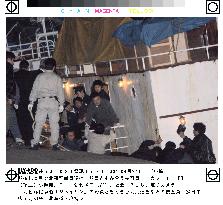 Hokkaido police raid N. Korean ship over fake $100 bills