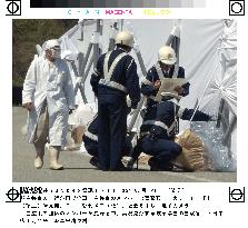 (5)White-robed cult wraps trees along Gifu road