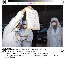 White-robed group in Gifu promises to move on