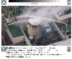 Firefighters resume pouring water into burning Mie silo