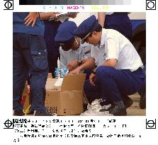 Customs officers check cargo