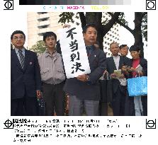 Tokyo court rejects suit linking smoking, cancer