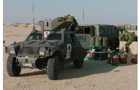 GSDF advance team for Iraq unloads goods in Kuwait