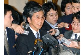Yabunaka talks to reporters