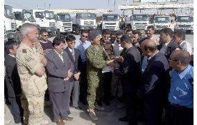 (1)Japan provides Iraq with water trucks