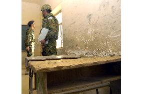 (2)GSDF unit head visits Samawah schools to take aid requests