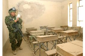 (3)Japanese troops begin repair on school buildings