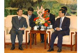 Ex-Foreign Minister Komura meets Chinese Pres. Hu