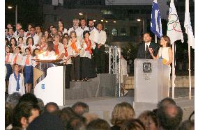 Olympic torch arrives back in Greece