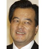 Okada smiles after retaining DPJ presidency