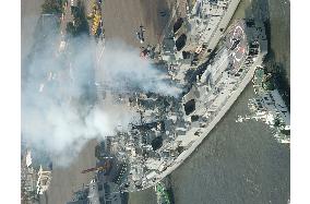 White smoke billows from Indian Navy destroyer in Tokyo Bay