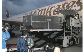 Plane carrying Koda's body arrives in Japan