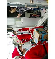 Volunteer Santa Claus brings gifts to quake victims