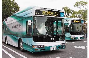 Toyota unveils hydrogen-powered fuel cell hybrid bus before expo