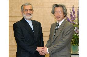 Iran's Foreign Minister Kharrazi talks with Koizumi