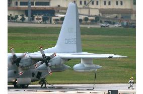 U.S. Marine plane drags fuel hose on runway in landing in Okinawa