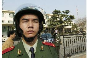 Police stand alert in front of Japanese Embassy in Beijing