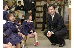 Crown Prince Naruhito talks to children in Osaka