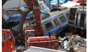 (1)Train cars demolished at accident site in Hyogo Pref.