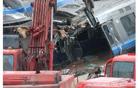 (2)Train cars demolished at accident site in Hyogo Pref.