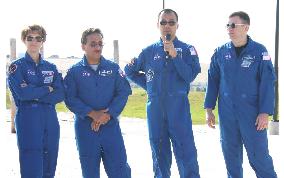 Astronauts meet reporters after shuttle launch postponed