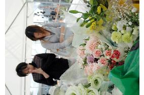 Carnations offered for train crash victims