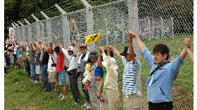 Protesters form human chain around U.S. military base in Okinawa