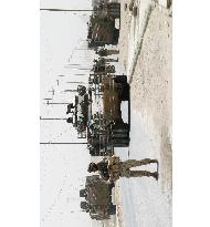 Japan troop vehicle damaged in suspected attack in Iraq