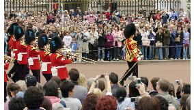 Tourists visit Buckingham Palace to see Changing of Guard