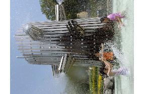 Children bathe at Aichi Expo