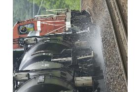 Water train douses rails in Hokkaido due to hot weather