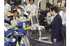 Crown Prince Naruhito meets robot