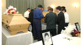 Coffins of 2 teachers slain in Afghanistan placed at embassy