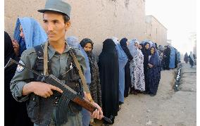 Afghans brave threats by militants, vote in landmark elections