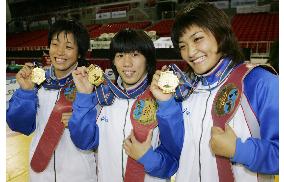 Japan's women claim gold treble at wrestling world championships