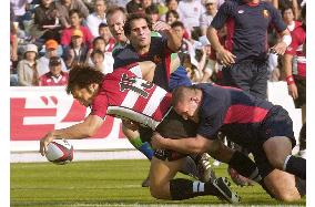 Japan romps over Spain in 1st victory for Elissalde