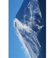 Strong winds blow snow from top of Mt. Fuji