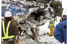 Rescuers resume search for victims under crashed train cars