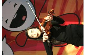 Japanese viola player plays at Olympic Village in Turin