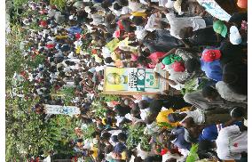 Supporters of Rene Preval march in Port-au-Prince
