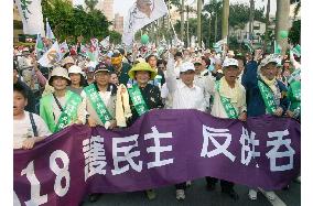 Thousands rally in Taiwan to protest China's military buildup