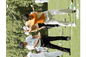 Golfers preparing for Masters Tournament