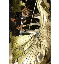 JAL unveils wreckage of 1985 jumbo jet crash for display