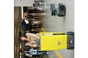 New airport in Fukuoka tests 'porter robots' to carry people, baggage