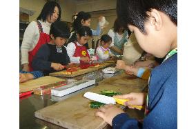 Children getting lessons in cooking, appreciation